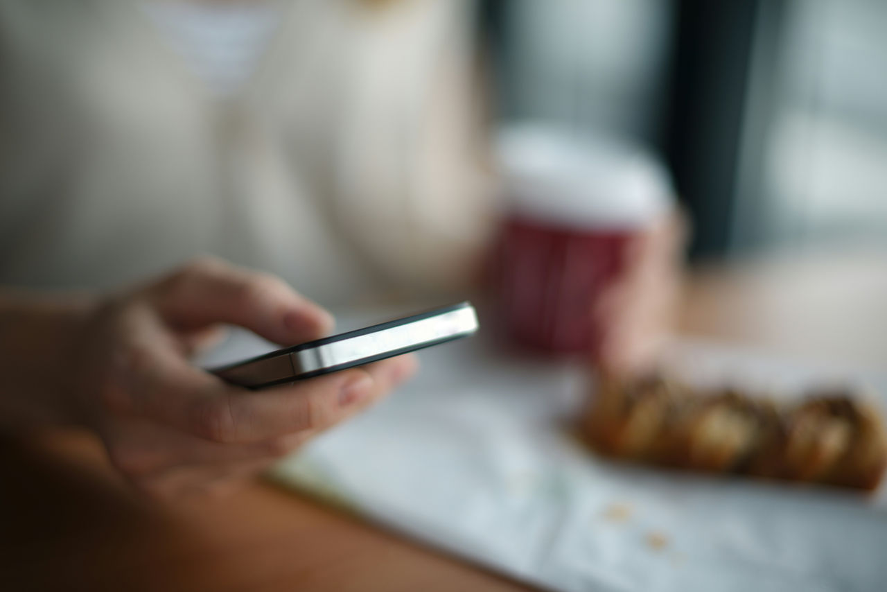 A person checking the mobile phone