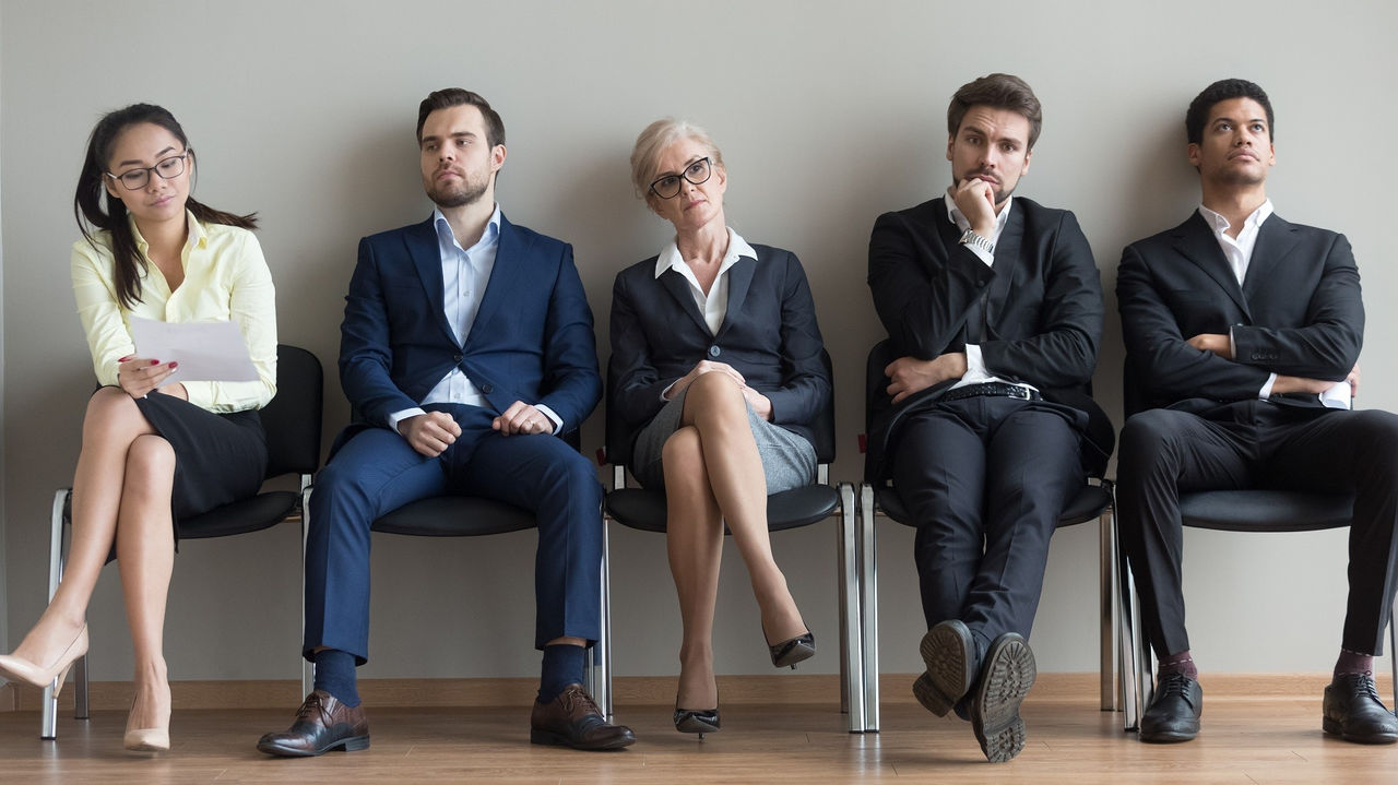 Diverse applicants waiting for their turn preparing for job interview Diverse applicants waiting for their turn preparing for job interview