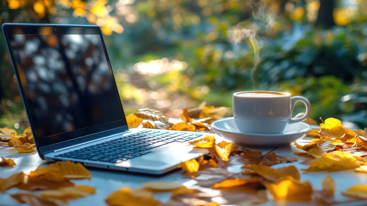 coffee and laptop in nature