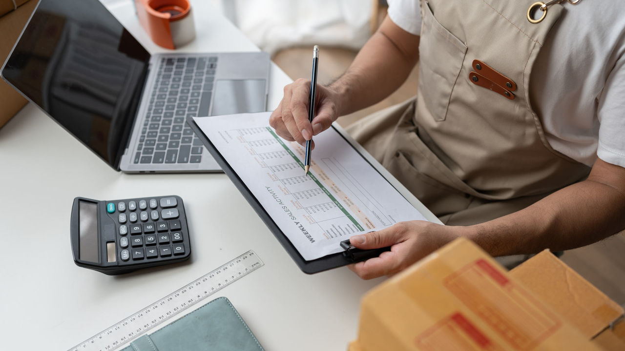 Startup, small business, SME owner check online orders. data logging Business growth, selling products, working with boxes. freelance work at home office online sme business small organization