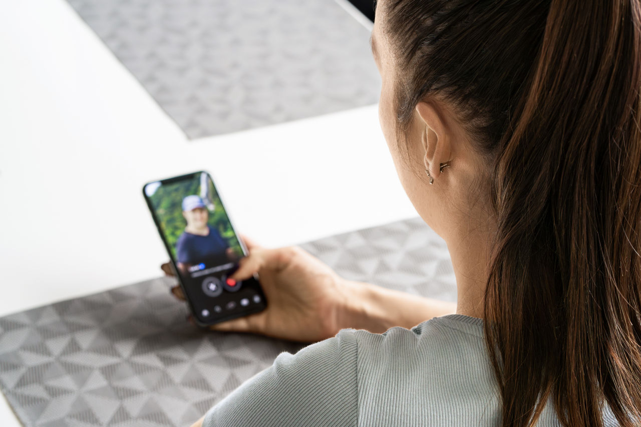 Date app for online romance. Woman and man. Love scam. Swipe singles on relationship site in phone. Cheat, deception or infidelity. Couple concept. Catfish profile picture on website.